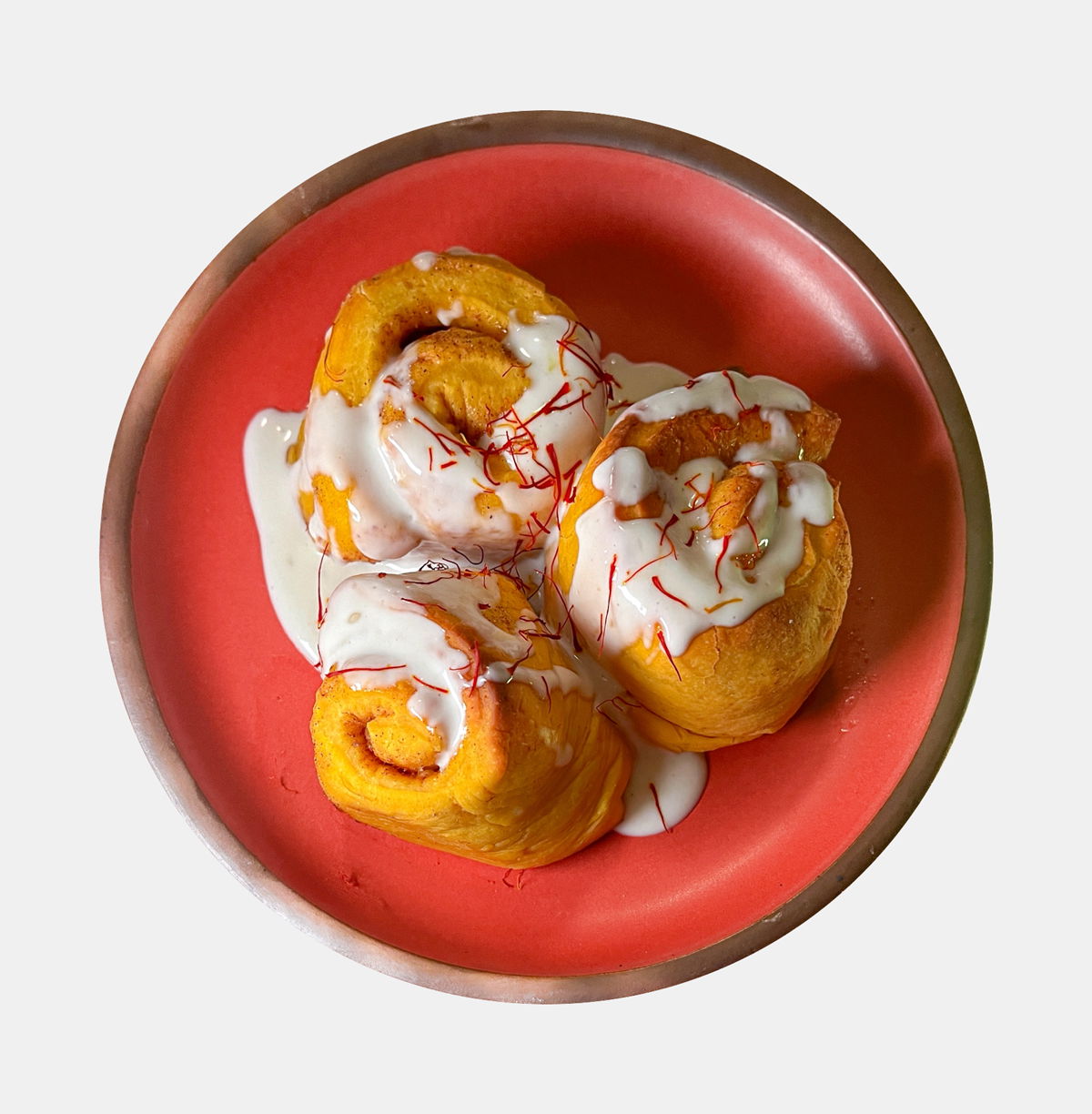 saffron rolls with labneh frosting