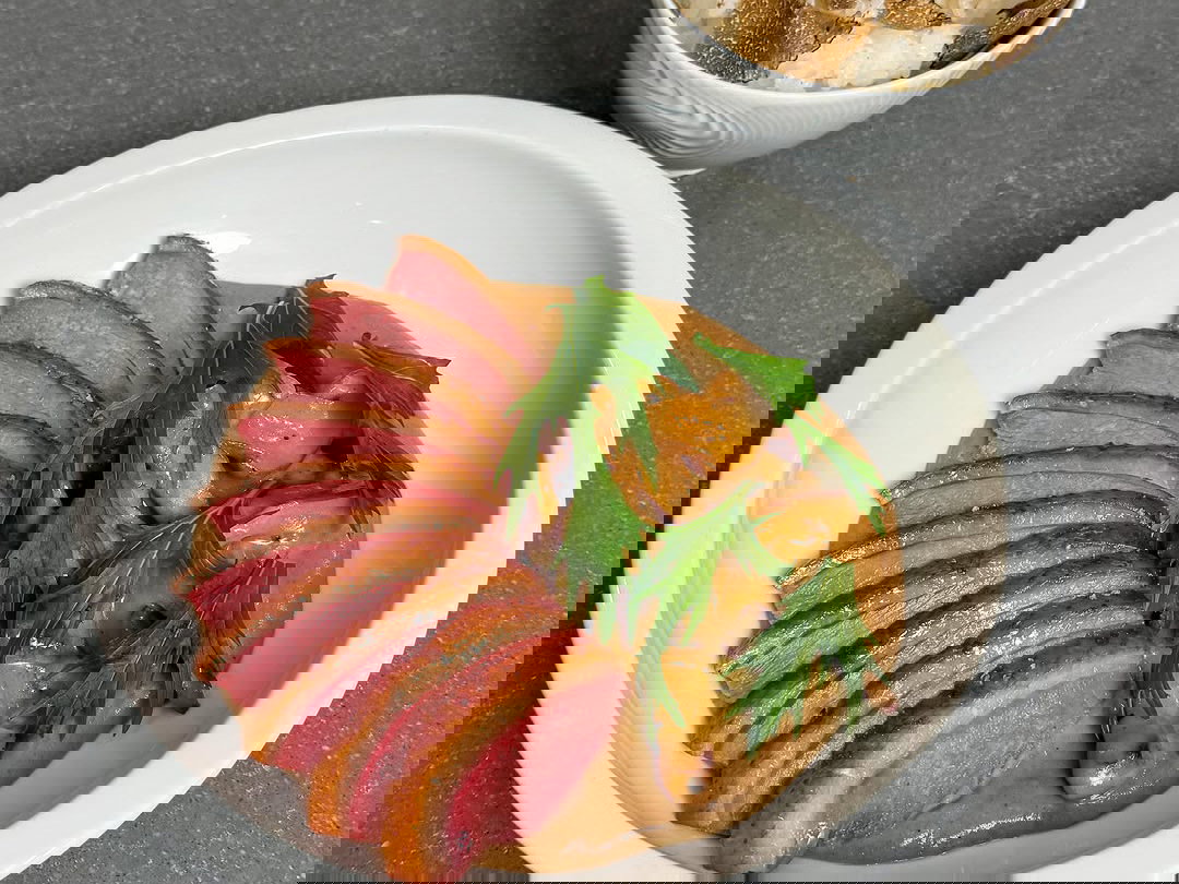 Dry-Aged Duck with Umeboshi-Mushroom Puree, Sautéed Matsutakes, and Black Truffle Rice